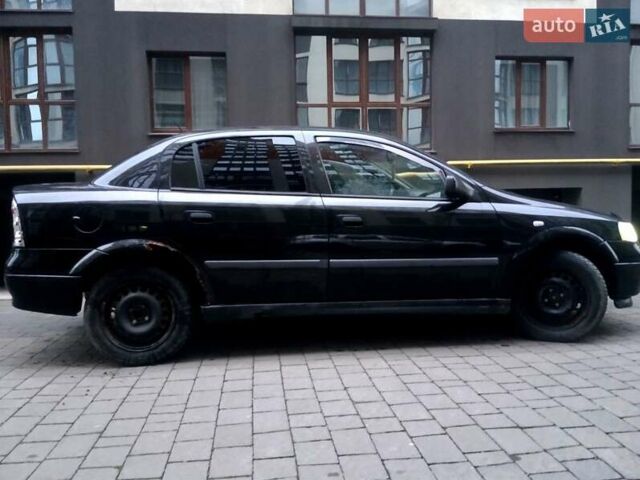 Черный Опель Астра, объемом двигателя 1.39 л и пробегом 214 тыс. км за 1800 $, фото 17 на Automoto.ua