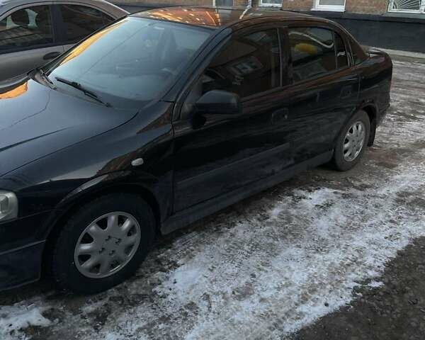 Черный Опель Астра, объемом двигателя 1.39 л и пробегом 280 тыс. км за 3300 $, фото 28 на Automoto.ua