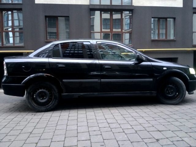 Черный Опель Астра, объемом двигателя 1.4 л и пробегом 214 тыс. км за 1800 $, фото 11 на Automoto.ua