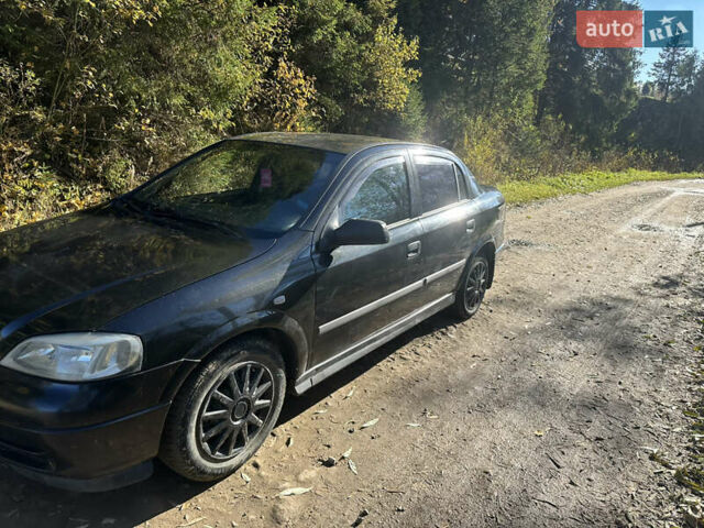 Черный Опель Астра, объемом двигателя 1.4 л и пробегом 230 тыс. км за 2100 $, фото 2 на Automoto.ua