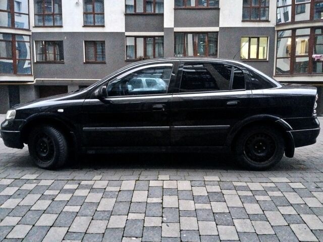 Черный Опель Астра, объемом двигателя 1.4 л и пробегом 214 тыс. км за 1800 $, фото 12 на Automoto.ua