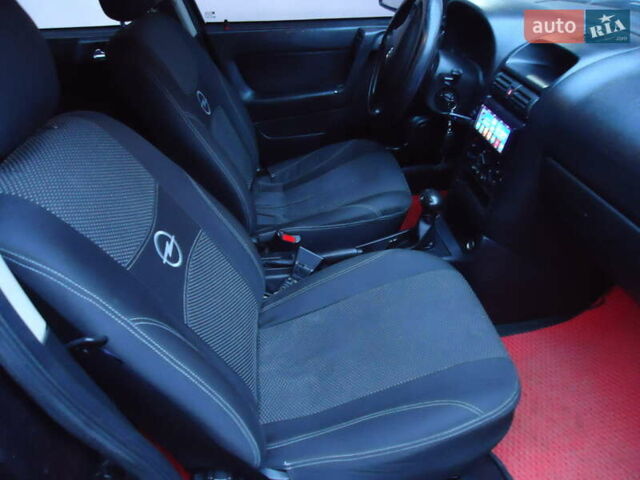 Черный Опель Астра, объемом двигателя 2 л и пробегом 300 тыс. км за 3500 $, фото 7 на Automoto.ua