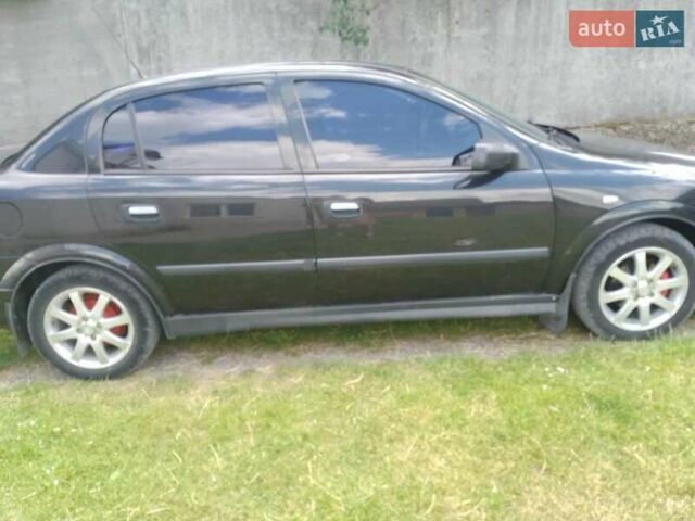 Черный Опель Астра, объемом двигателя 1.4 л и пробегом 243 тыс. км за 3200 $, фото 10 на Automoto.ua
