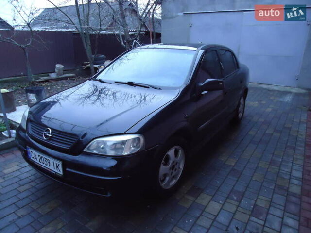 Черный Опель Астра, объемом двигателя 2 л и пробегом 300 тыс. км за 3500 $, фото 1 на Automoto.ua