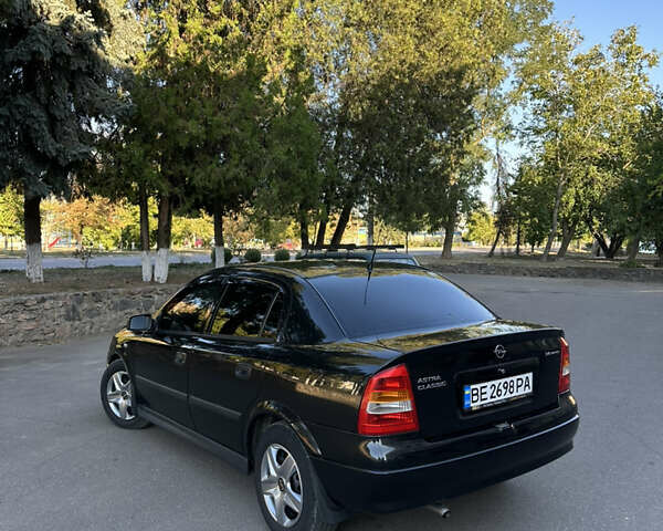 Черный Опель Астра, объемом двигателя 1.4 л и пробегом 212 тыс. км за 4200 $, фото 7 на Automoto.ua