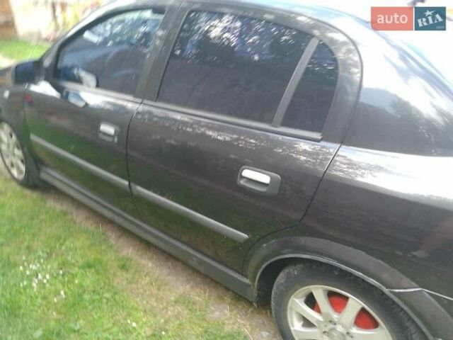 Черный Опель Астра, объемом двигателя 1.4 л и пробегом 243 тыс. км за 3200 $, фото 5 на Automoto.ua