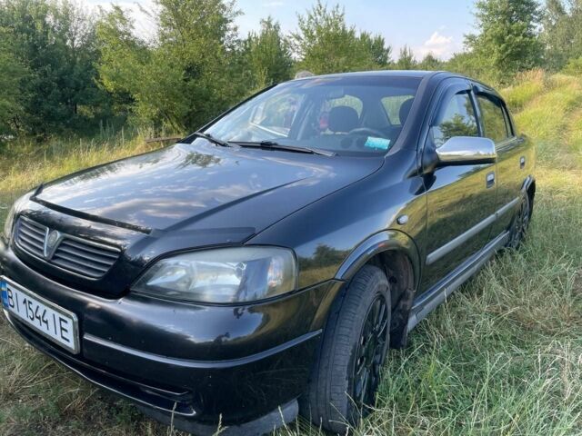 Черный Опель Астра, объемом двигателя 1.4 л и пробегом 294 тыс. км за 3800 $, фото 3 на Automoto.ua