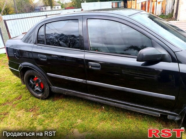 Черный Опель Астра, объемом двигателя 1.4 л и пробегом 412 тыс. км за 3100 $, фото 1 на Automoto.ua