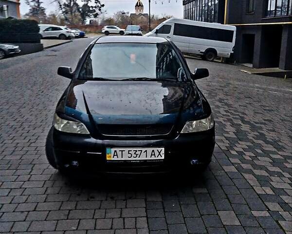 Черный Опель Астра, объемом двигателя 1.39 л и пробегом 214 тыс. км за 1800 $, фото 20 на Automoto.ua