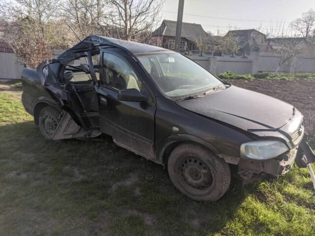 Черный Опель Астра, объемом двигателя 1 л и пробегом 280 тыс. км за 450 $, фото 1 на Automoto.ua