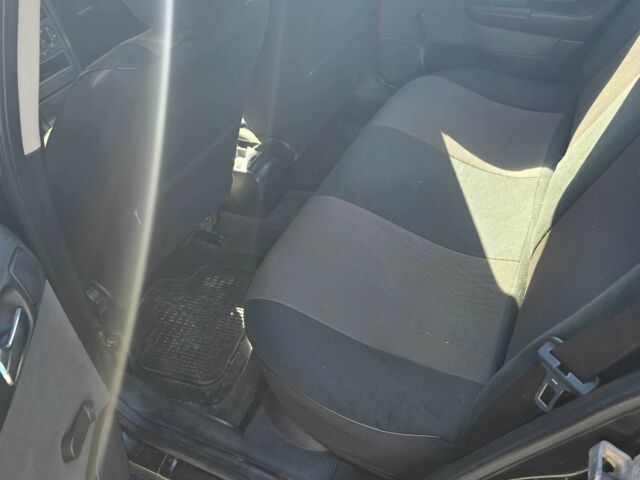 Черный Опель Астра, объемом двигателя 1.4 л и пробегом 240 тыс. км за 3000 $, фото 6 на Automoto.ua