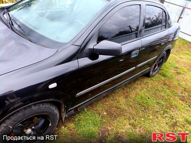 Черный Опель Астра, объемом двигателя 1.4 л и пробегом 412 тыс. км за 3100 $, фото 3 на Automoto.ua