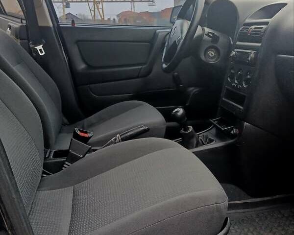 Черный Опель Астра, объемом двигателя 1.39 л и пробегом 214 тыс. км за 1800 $, фото 25 на Automoto.ua