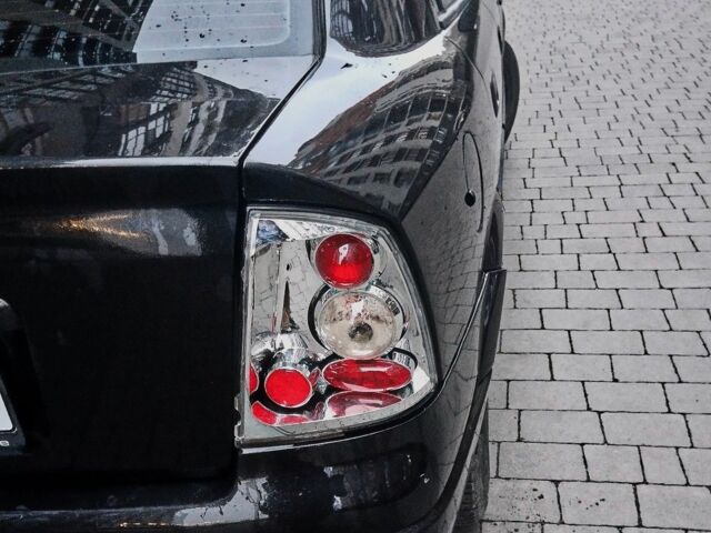 Черный Опель Астра, объемом двигателя 1.4 л и пробегом 214 тыс. км за 1800 $, фото 8 на Automoto.ua