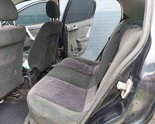 Черный Опель Астра, объемом двигателя 1.6 л и пробегом 147 тыс. км за 2700 $, фото 11 на Automoto.ua