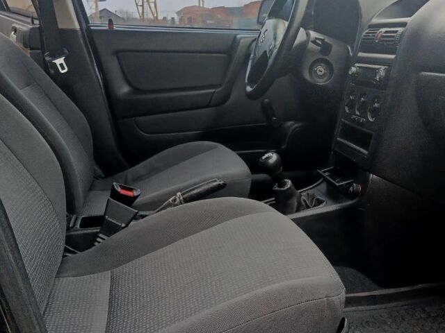 Черный Опель Астра, объемом двигателя 1.4 л и пробегом 214 тыс. км за 1800 $, фото 22 на Automoto.ua