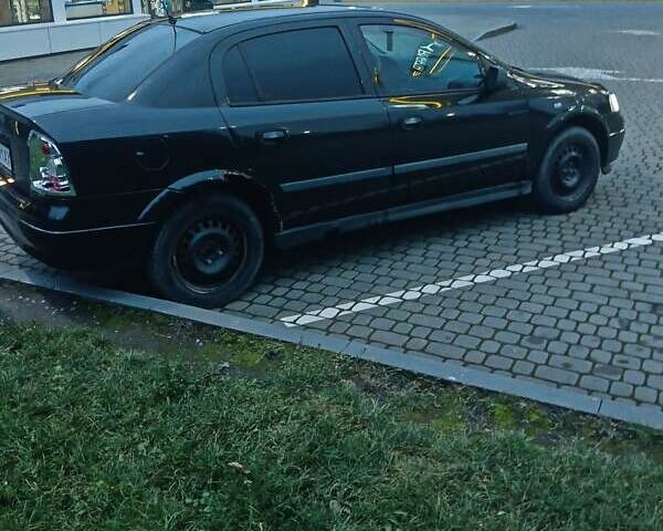 Черный Опель Астра, объемом двигателя 1.39 л и пробегом 214 тыс. км за 1800 $, фото 6 на Automoto.ua