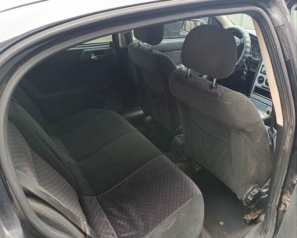 Черный Опель Астра, объемом двигателя 1.6 л и пробегом 147 тыс. км за 2700 $, фото 6 на Automoto.ua