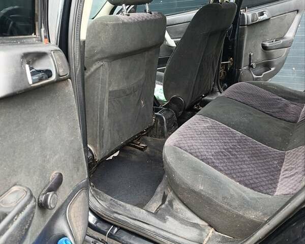 Черный Опель Астра, объемом двигателя 1.6 л и пробегом 147 тыс. км за 2700 $, фото 12 на Automoto.ua