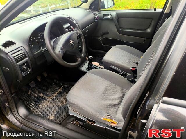 Черный Опель Астра, объемом двигателя 1.4 л и пробегом 412 тыс. км за 3100 $, фото 6 на Automoto.ua