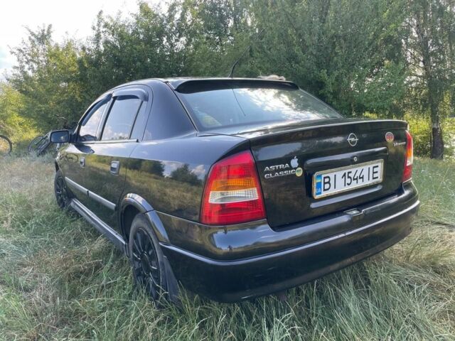 Черный Опель Астра, объемом двигателя 1.4 л и пробегом 294 тыс. км за 3800 $, фото 1 на Automoto.ua
