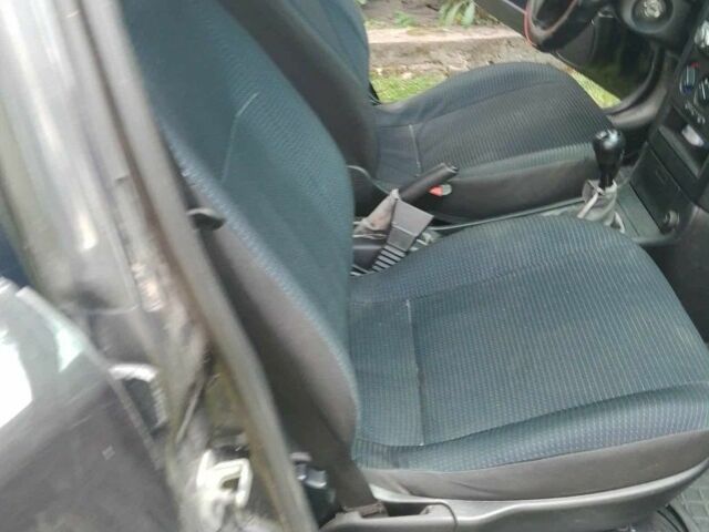 Черный Опель Астра, объемом двигателя 1.4 л и пробегом 243 тыс. км за 3200 $, фото 4 на Automoto.ua