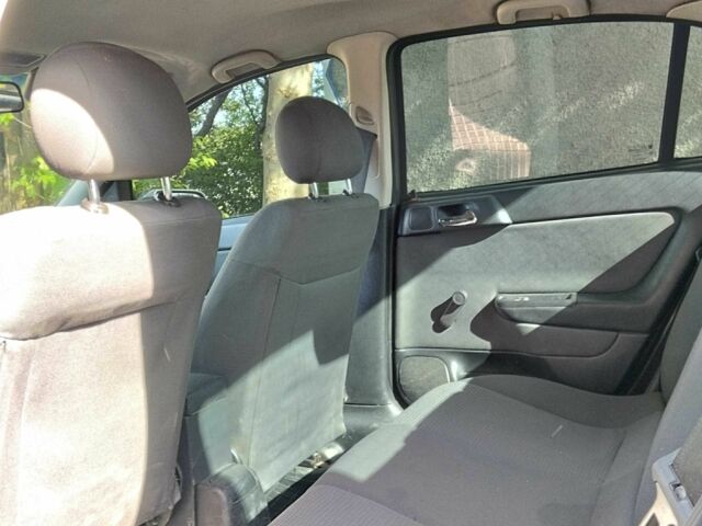 Черный Опель Астра, объемом двигателя 1.4 л и пробегом 304 тыс. км за 3250 $, фото 6 на Automoto.ua