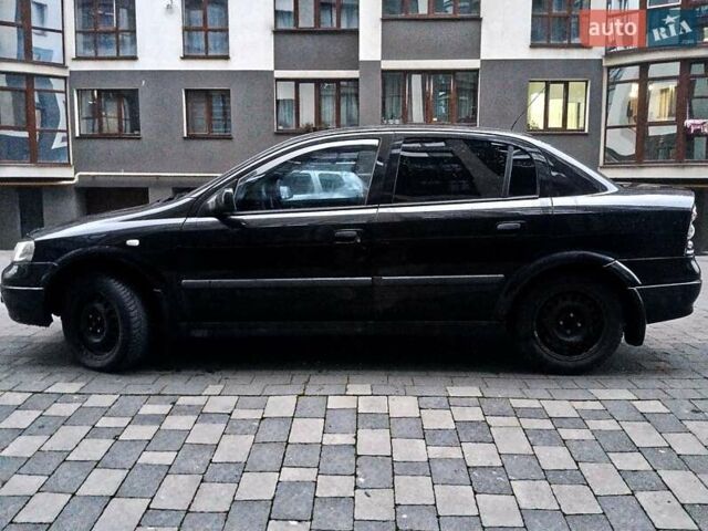 Черный Опель Астра, объемом двигателя 1.39 л и пробегом 214 тыс. км за 1800 $, фото 21 на Automoto.ua