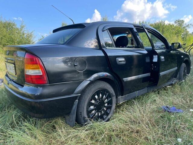 Черный Опель Астра, объемом двигателя 1.4 л и пробегом 294 тыс. км за 3800 $, фото 7 на Automoto.ua