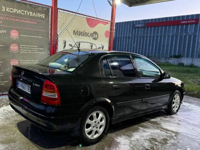 Черный Опель Астра, объемом двигателя 1.4 л и пробегом 215 тыс. км за 3500 $, фото 4 на Automoto.ua