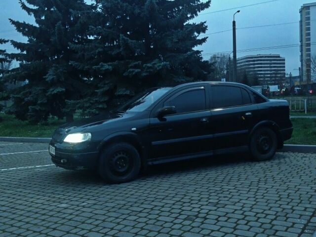 Черный Опель Астра, объемом двигателя 1.4 л и пробегом 214 тыс. км за 1800 $, фото 4 на Automoto.ua