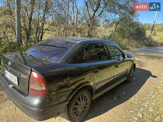 Черный Опель Астра, объемом двигателя 1.4 л и пробегом 230 тыс. км за 2100 $, фото 4 на Automoto.ua