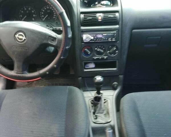 Черный Опель Астра, объемом двигателя 1.4 л и пробегом 243 тыс. км за 3200 $, фото 4 на Automoto.ua