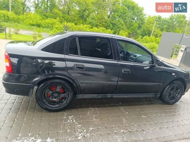 Черный Опель Астра, объемом двигателя 1.6 л и пробегом 147 тыс. км за 2700 $, фото 25 на Automoto.ua