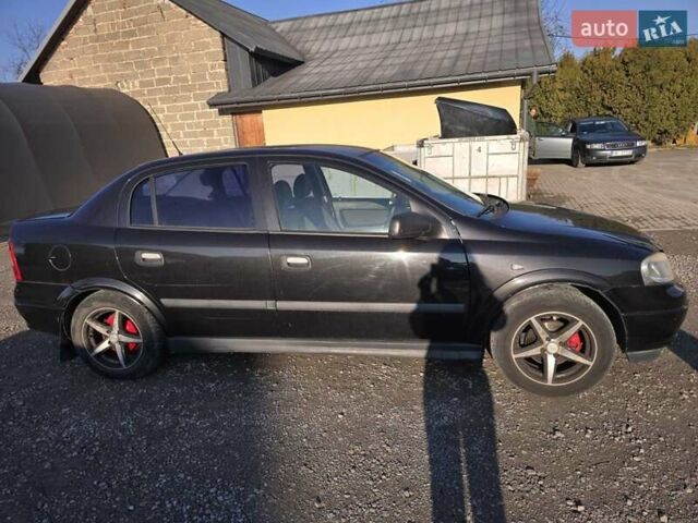 Черный Опель Астра, объемом двигателя 1.6 л и пробегом 217 тыс. км за 3800 $, фото 6 на Automoto.ua