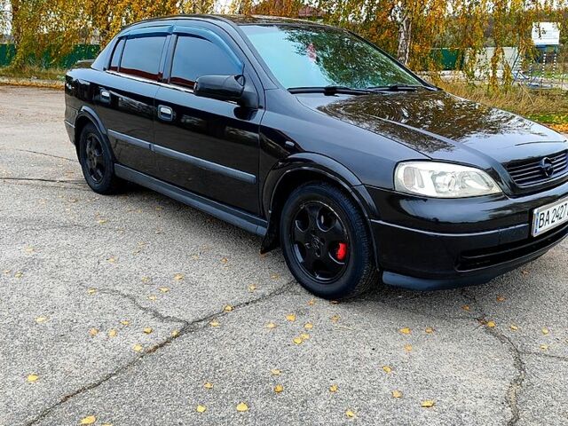 Черный Опель Астра, объемом двигателя 1.4 л и пробегом 202 тыс. км за 3550 $, фото 12 на Automoto.ua