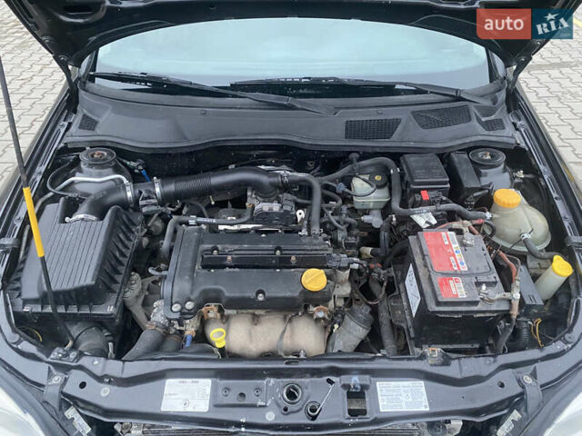 Черный Опель Астра, объемом двигателя 1.4 л и пробегом 229 тыс. км за 3200 $, фото 21 на Automoto.ua