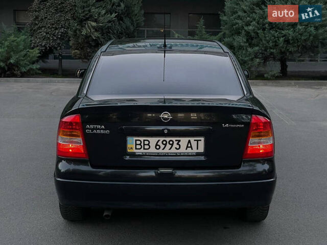Черный Опель Астра, объемом двигателя 1.4 л и пробегом 90 тыс. км за 5900 $, фото 6 на Automoto.ua