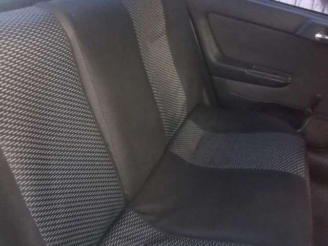 Черный Опель Астра, объемом двигателя 1.4 л и пробегом 129 тыс. км за 3700 $, фото 1 на Automoto.ua