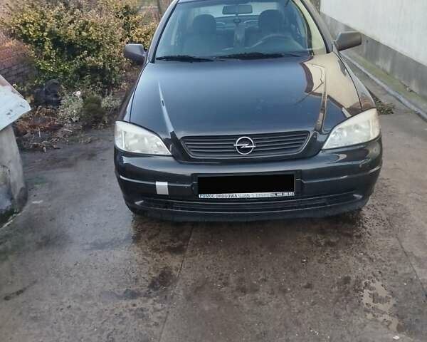 Черный Опель Астра, объемом двигателя 1.6 л и пробегом 217 тыс. км за 3800 $, фото 3 на Automoto.ua