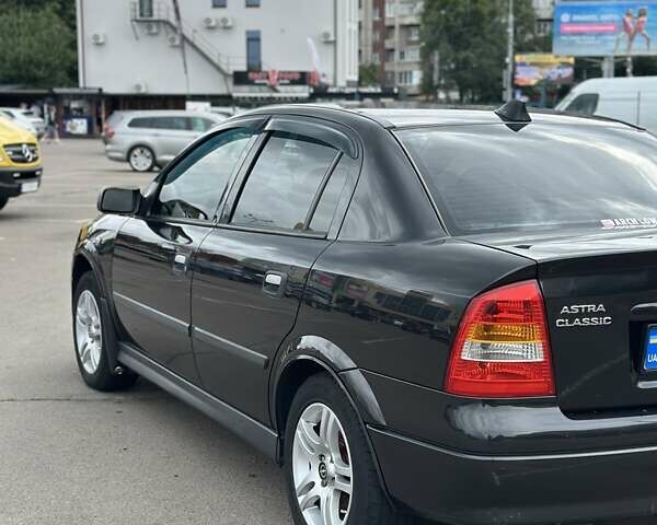 Черный Опель Астра, объемом двигателя 1.4 л и пробегом 277 тыс. км за 3300 $, фото 3 на Automoto.ua
