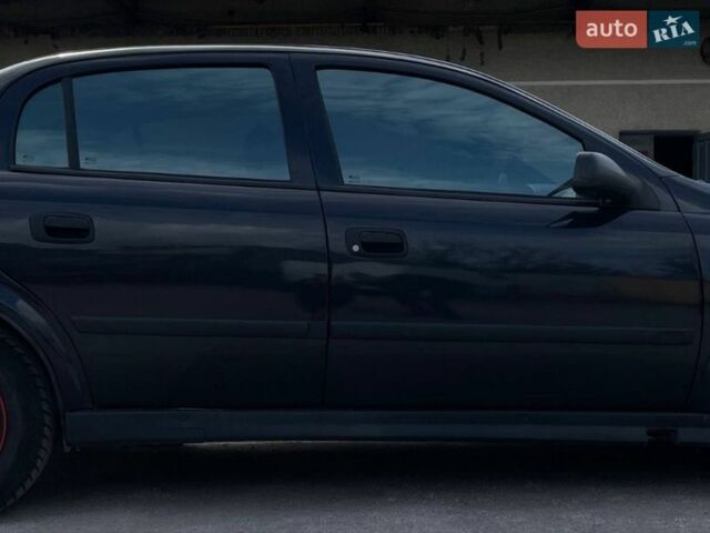 Черный Опель Астра, объемом двигателя 1.4 л и пробегом 270 тыс. км за 3000 $, фото 7 на Automoto.ua