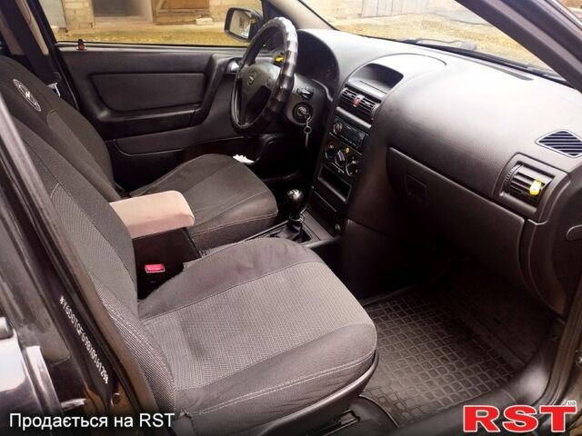 Черный Опель Астра, объемом двигателя 1.4 л и пробегом 250 тыс. км за 3999 $, фото 8 на Automoto.ua