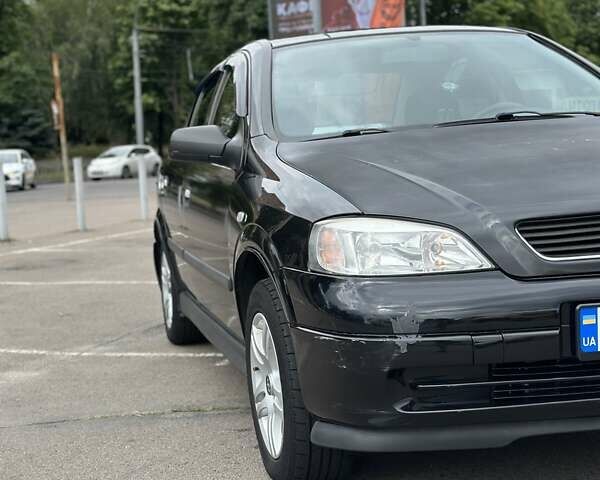 Черный Опель Астра, объемом двигателя 1.4 л и пробегом 277 тыс. км за 3300 $, фото 9 на Automoto.ua