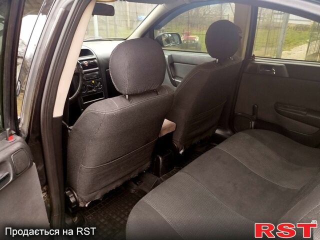 Черный Опель Астра, объемом двигателя 1.4 л и пробегом 250 тыс. км за 3999 $, фото 10 на Automoto.ua