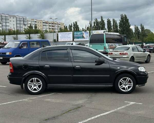 Черный Опель Астра, объемом двигателя 1.4 л и пробегом 277 тыс. км за 3300 $, фото 7 на Automoto.ua