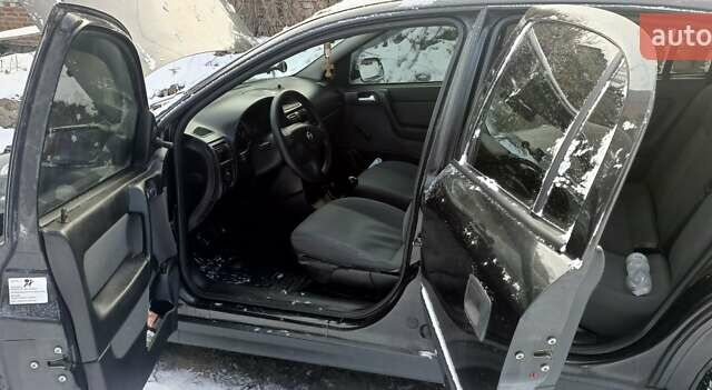 Черный Опель Астра, объемом двигателя 1.4 л и пробегом 160 тыс. км за 4200 $, фото 7 на Automoto.ua