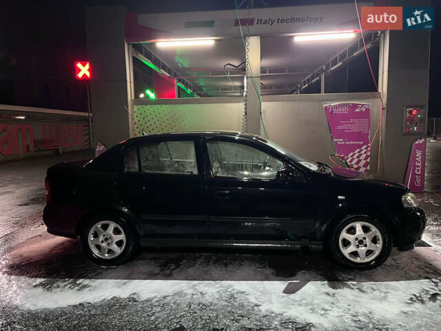 Чорний Опель Астра, об'ємом двигуна 1.4 л та пробігом 338 тис. км за 2300 $, фото 12 на Automoto.ua