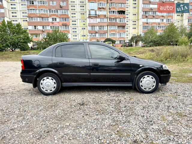 Черный Опель Астра, объемом двигателя 1.4 л и пробегом 176 тыс. км за 4390 $, фото 7 на Automoto.ua