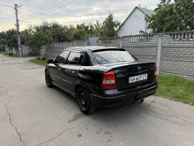 Черный Опель Астра, объемом двигателя 1.4 л и пробегом 240 тыс. км за 1554 $, фото 5 на Automoto.ua